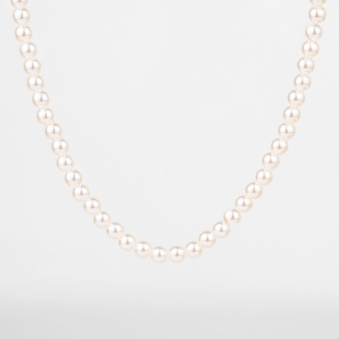 Collier de perles pour homme porté