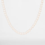 Collier de perles pour homme porté